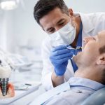 Dentist examining patient during a dental implant procedure in a modern clinic in Turkey