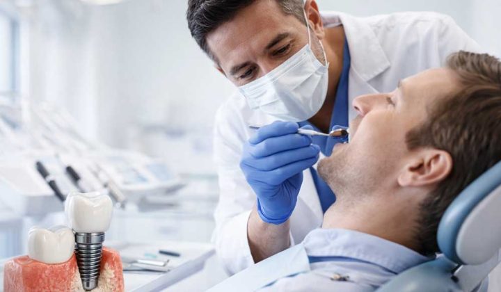 Dentist examining patient during a dental implant procedure in a modern clinic in Turkey
